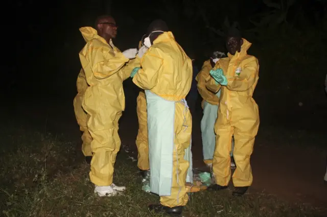 Health workers in protective clothes