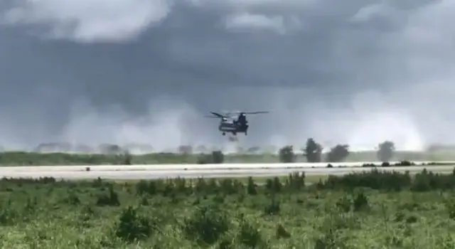 Helicopter dropping sand bags