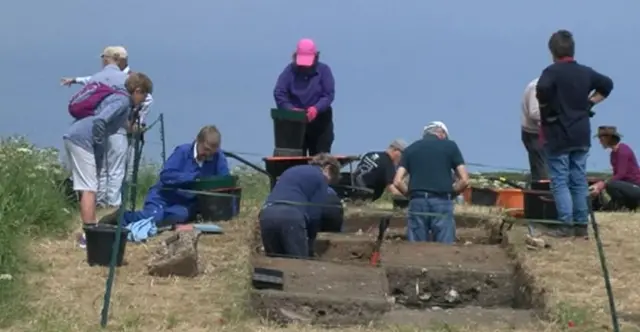 Volunteers excavating