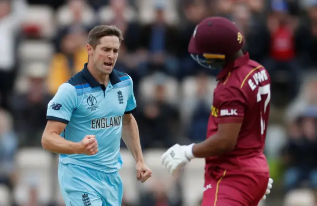 Chris Woakes celebrates taking the wicket of West Indies Evin Lewis