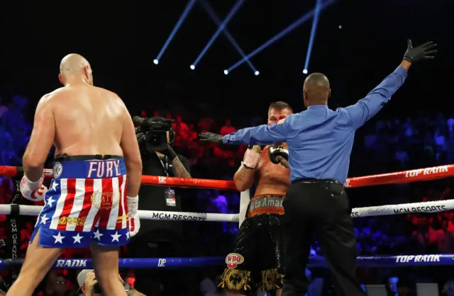 The referee waves the fight off