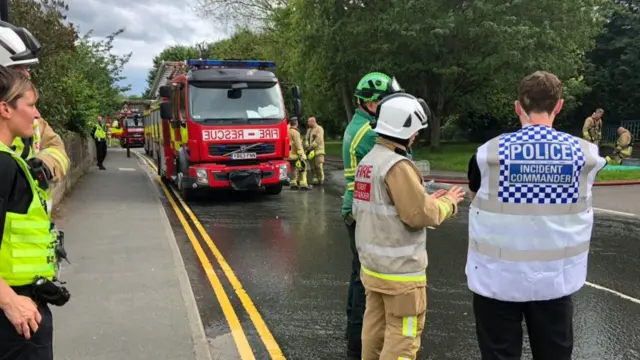 Emergency service workers planning how to tackle the fire