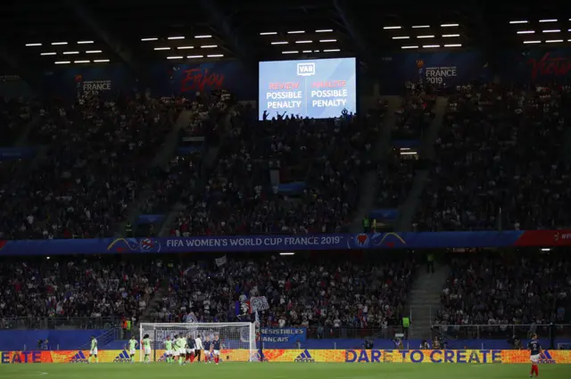 A shot of the crowd and the VAR screen