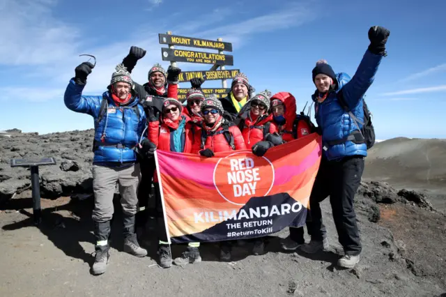 People at the summit of Kilimanjaro