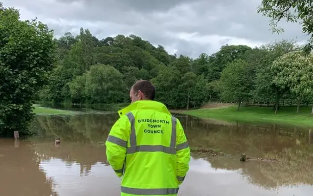 Man inspecting flooding