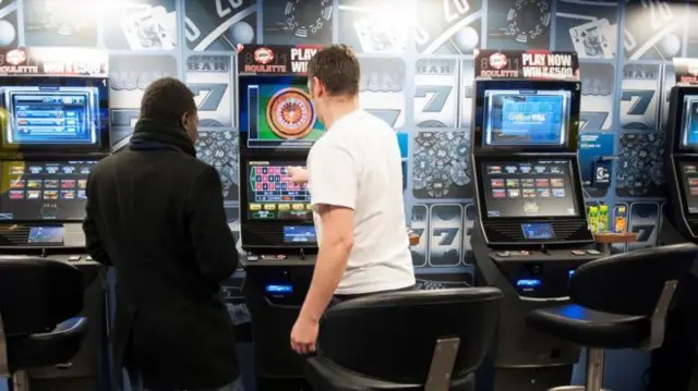 Gamblers at slot machines