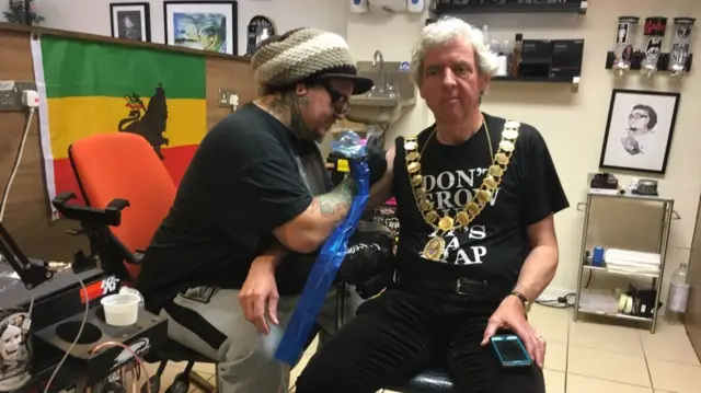 Mayor getting tattoo