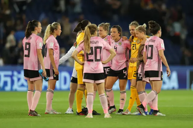 Scotland players gather at full-time after a heartbreaking draw