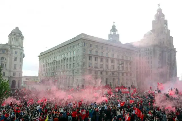 Liverpool parade passes Liver Building