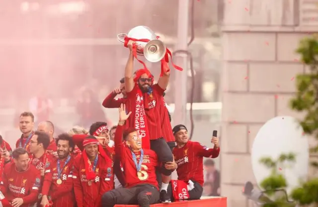 Liverpool"s Alisson with the trophy during the parade