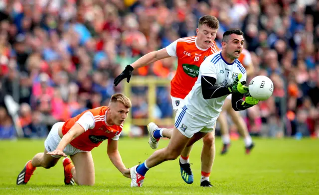 Orchard duo Rian O'Neill and Aiden Nugent can't prevent Breffni keeper Raymond Galligan getting the ball away