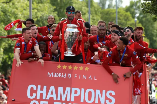 Jurgen Klopp holds Champions League trophy