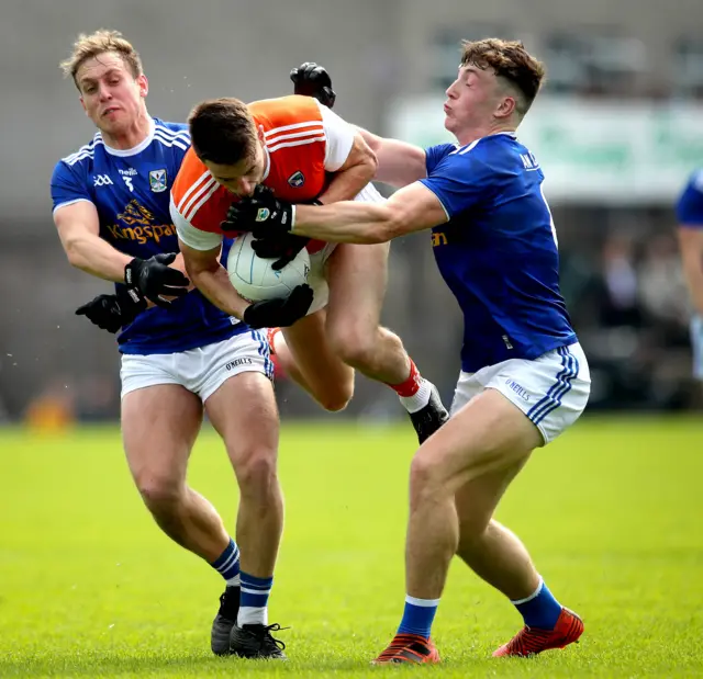 Armagh's Niall Grimley with Padraig Faulkner and Conor Brady of Cavan