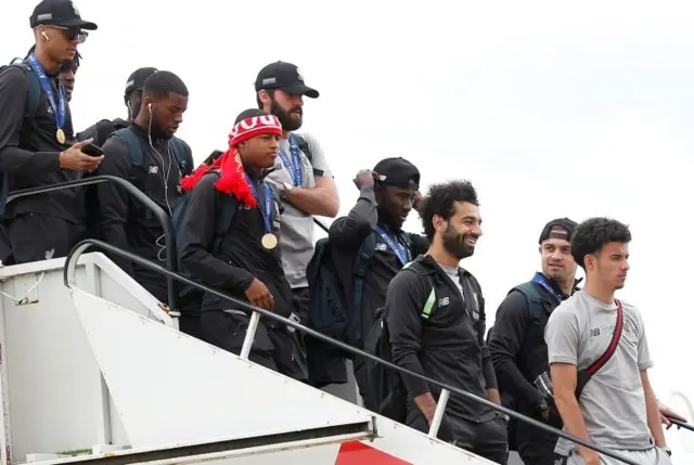 Liverpool players arrive at Liverpool John Lennon Airport