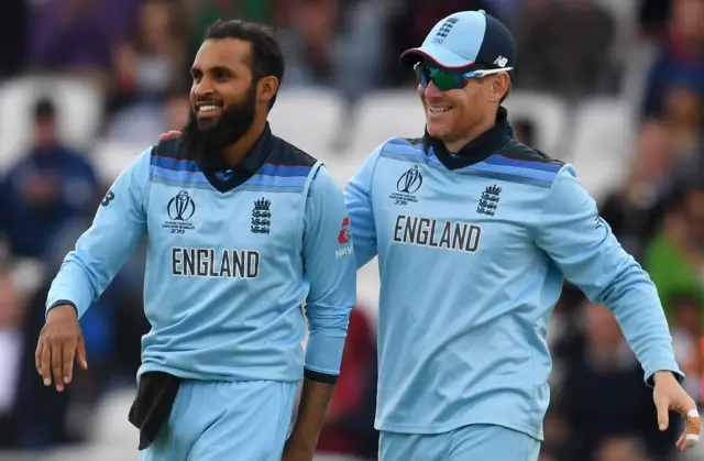 Adil Rashid (L) celebrates with England"s captain Eoin Morgan