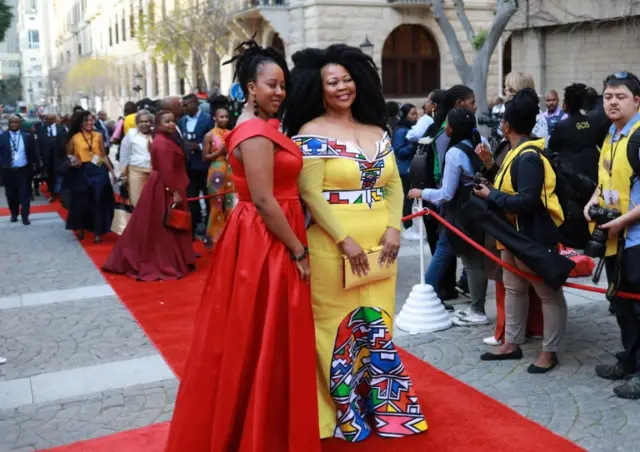 Two women in smart dresses