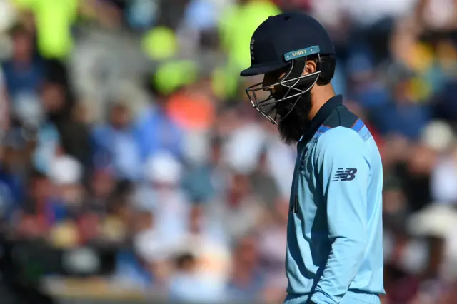 Moeen Ali walks back to the pavilion after losing his wicket for 16 runs