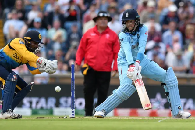 Joe Root watches the ball after playing a shot