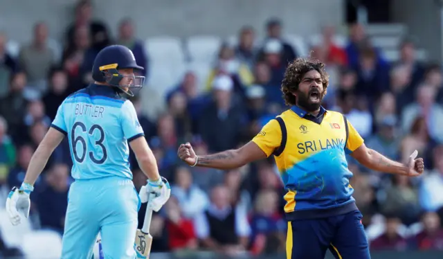 Lasith Malinga celebrates taking the wicket of England's Jos Buttler