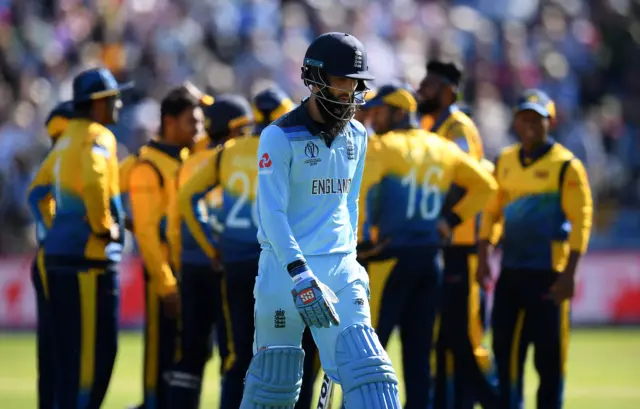 Moeen Ali of England walks off after being dismissed off the bowling of Dhananjaya de Silva