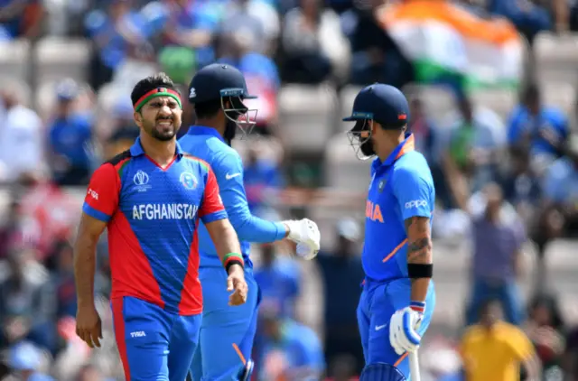 Aftab Alam (L) reacts after a missed chance to catch India's K.L. Rahul