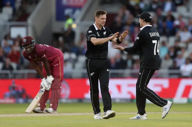 Matt Henry celebrates taking the wicket of West Indies' Kemar Roach