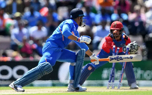 MS Dhoni of India is stumped by Ikram Ali Khil of Afghanistan