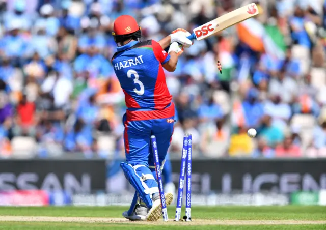 Hazratullah Zazai is bowled during the 2019 Cricket World Cup group stage match between India and Afghanistan