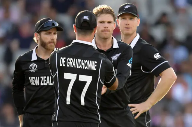 Lockie Ferguson (2nd R) celebrates with teammates