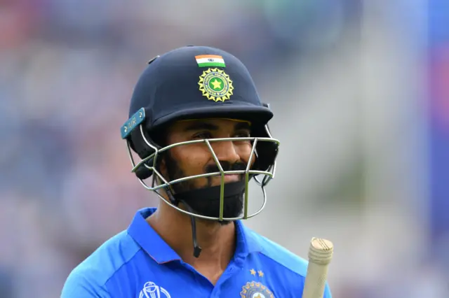 K.L. Rahul walks back to the pavilion after his dismissal