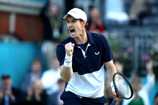 Andy Murray fist pumps and shouts in celebration