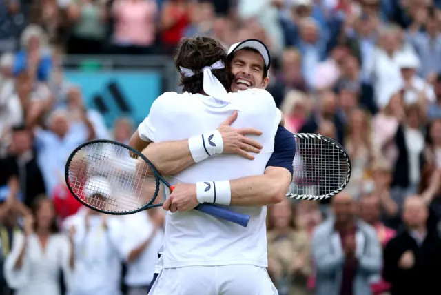 Murray and Lopez hug