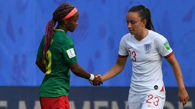 England and Cameroon players shake hands