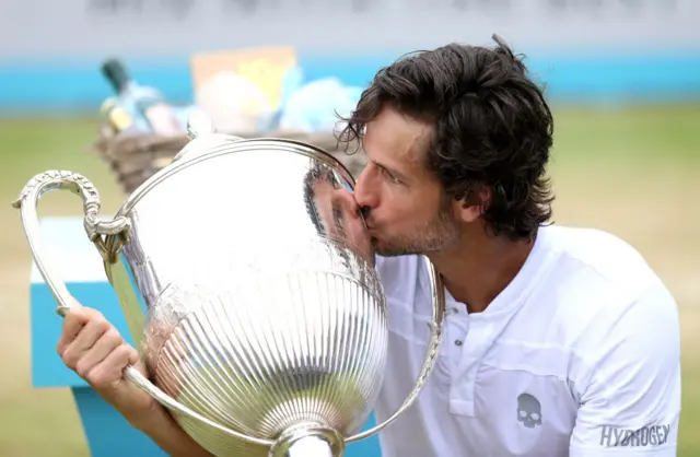 Lopez kisses the trophy