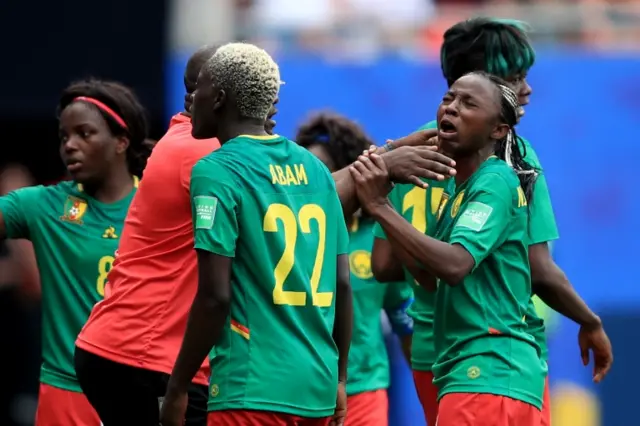 Cameroon Head Coach Alain Djeumfa tries to calm Ajara Nchout of Cameroon (R) as she reacts after her goal is disallowed via a VAR decision during the 2019 FIFA Women"s World Cup France Round Of 16 match between England and Cameroon at Stade du Hainau