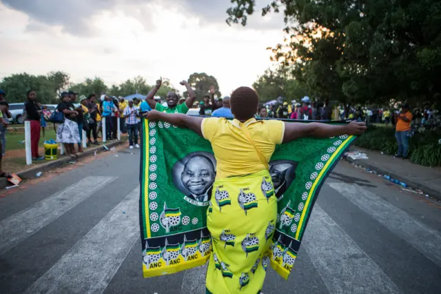 Woman holding Ramaphosa fabric