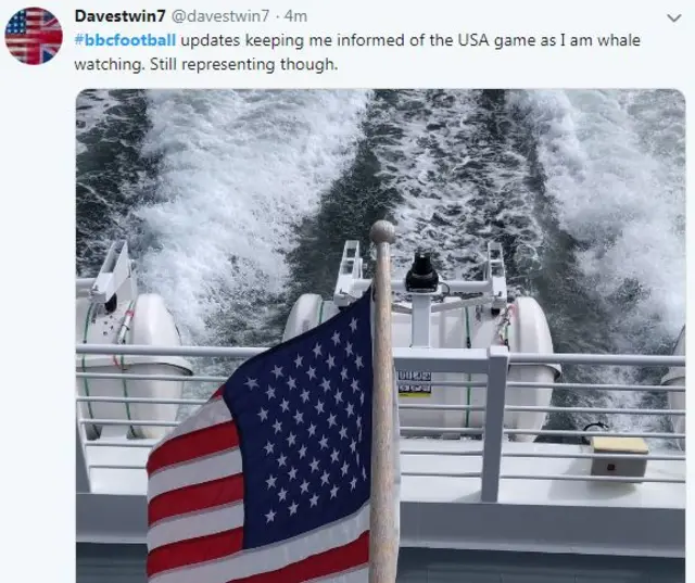 Picture of a tweet with USA flag on a boat