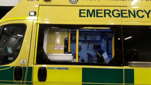 Smashed window on ambulance