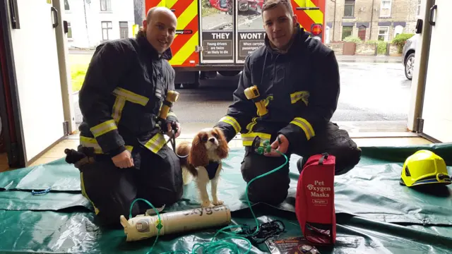 Firefighters with oxygen masks