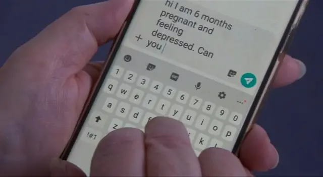 Text message on the screen of a phone