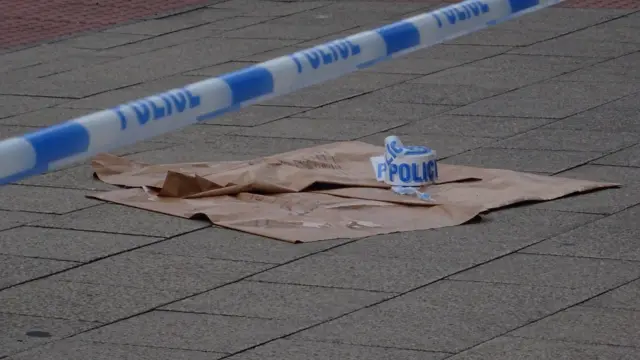 Police tape on the floor