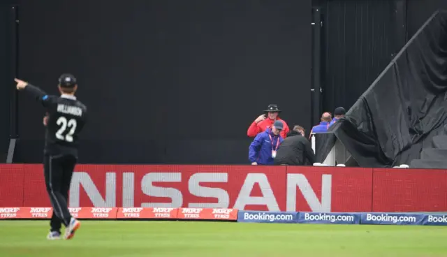 Groundstaff adjust a sightscreen at Edgbaston