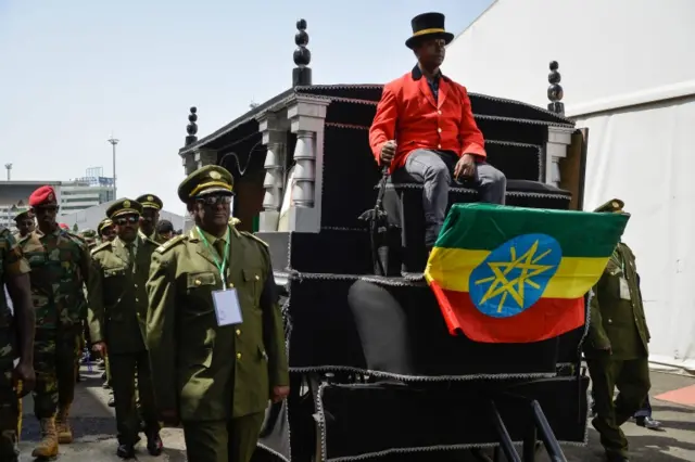 Hearse with an Ethiopian flag