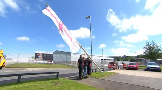 The flag being raised