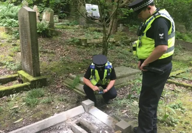 Police at the graves