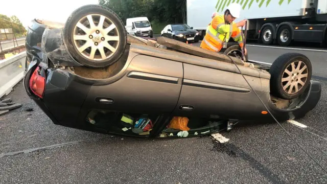 Car on roof on M6 near Stafford