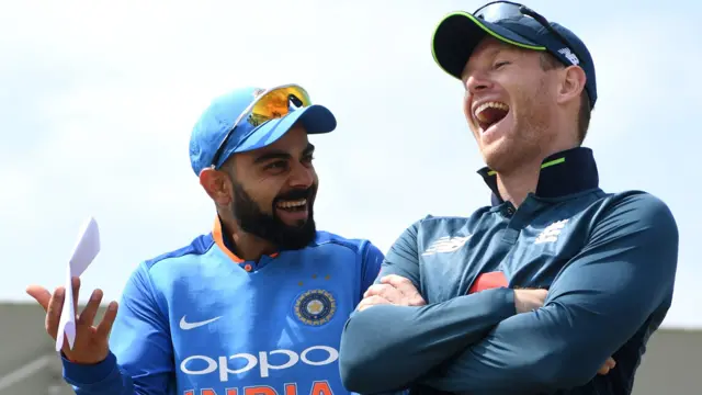 Virat Kohli and Eoin Morgan share a joke in 2018