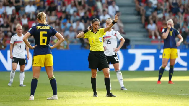 Referee Stephanie Frappart pauses play to discuss with the video assistant referee