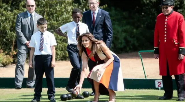 Melania and Philip met Chelsea pensioners and schoolchildren to play bowls