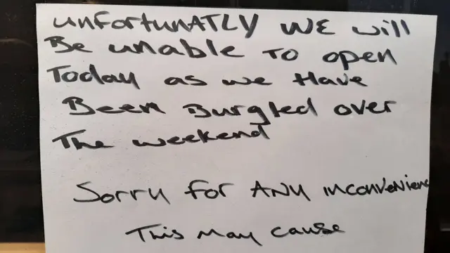 A note outside the Raise the Roof community hub